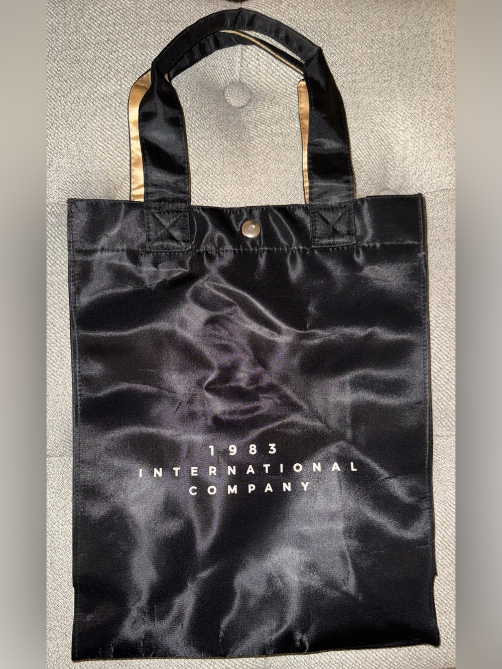 1983 International Company bag, 22”h x 9 1/4”w x 4”d